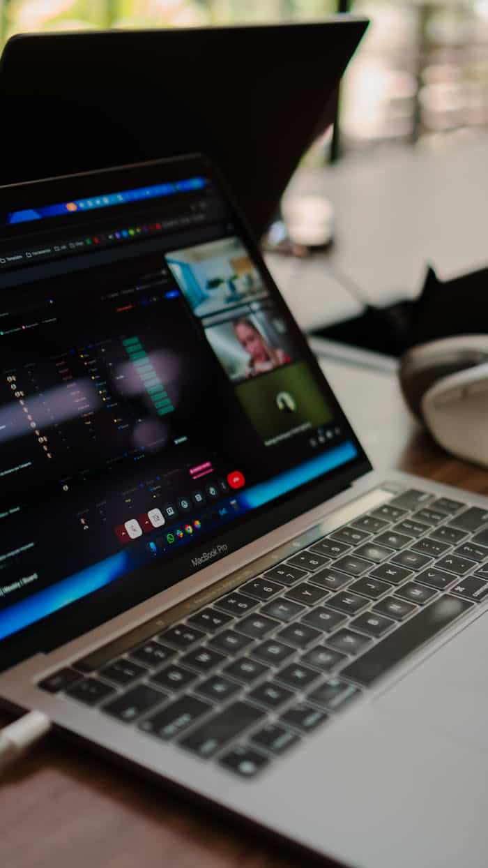 services-03 A laptop showing a video conference call, ideal for remote work concepts.